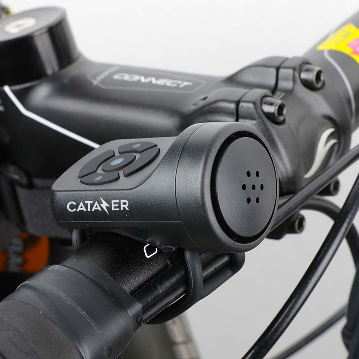 CATAZER Electronic Bike Horn Showing Flexible Rubber Strap Mount And Button Controls CATAZER electronic bike horn showing flexible rubber strap mount and button controls